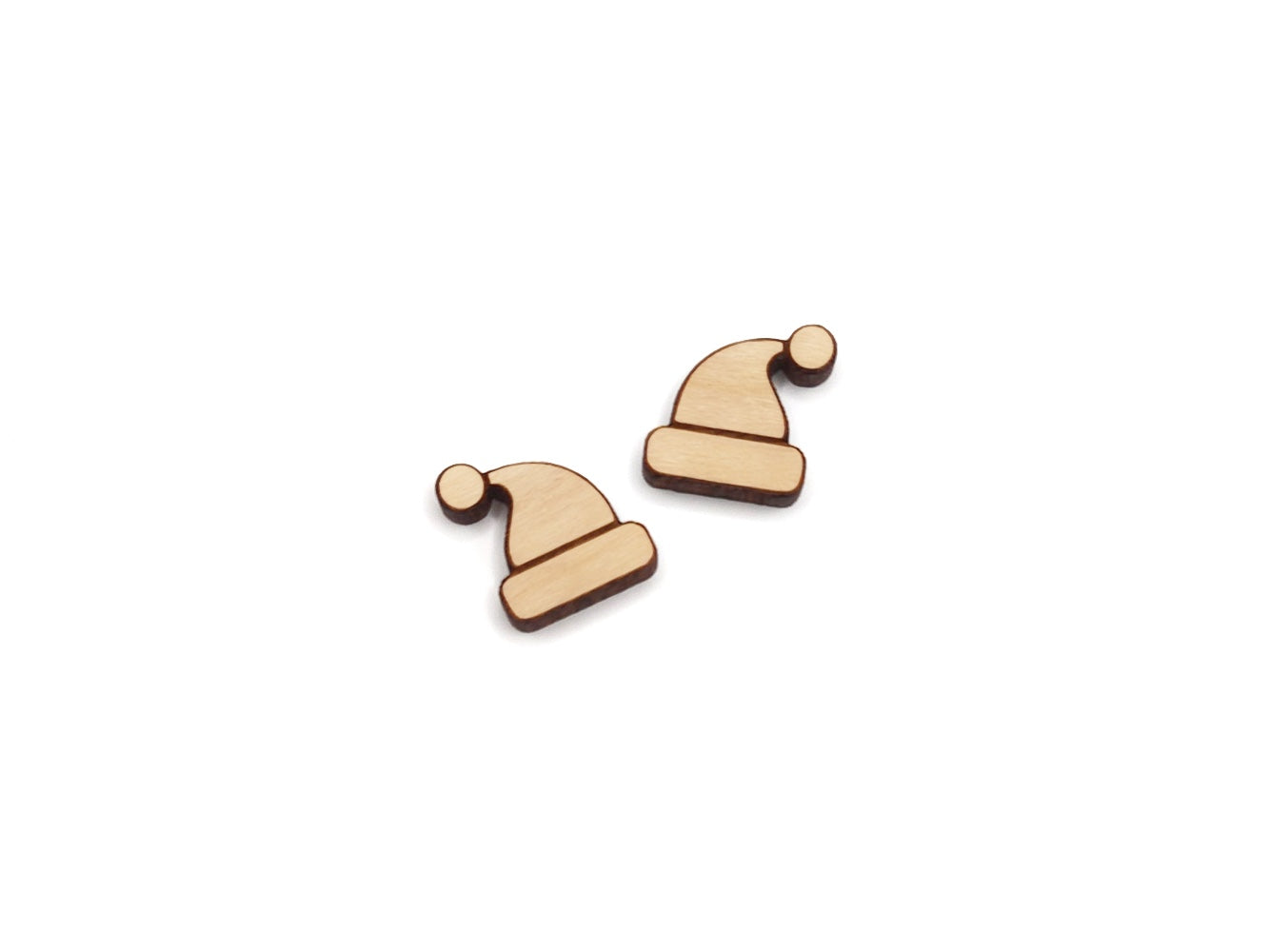 a pair of wooden cabochon stud earring blanks cut and engraved to look like a Santa hat
