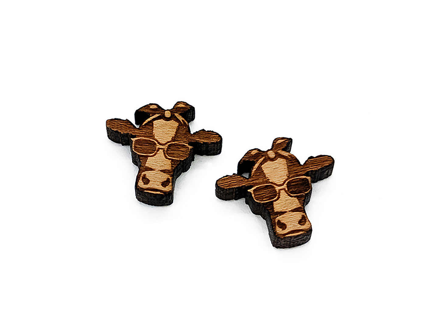 a pair of wooden giraffes wearing sunglasses