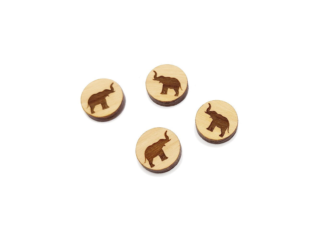 three wooden buttons with a picture of an elephant