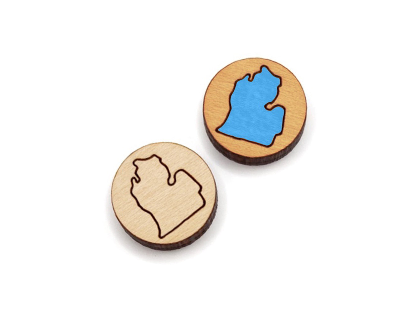 a pair of round wooden cabochon earring blanks engraved with the outline of the Michigan Mitten
