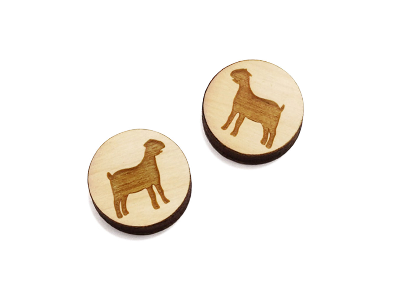 a pair of round wooden cabochon earring blanks engraved with a nubian goat silhouette