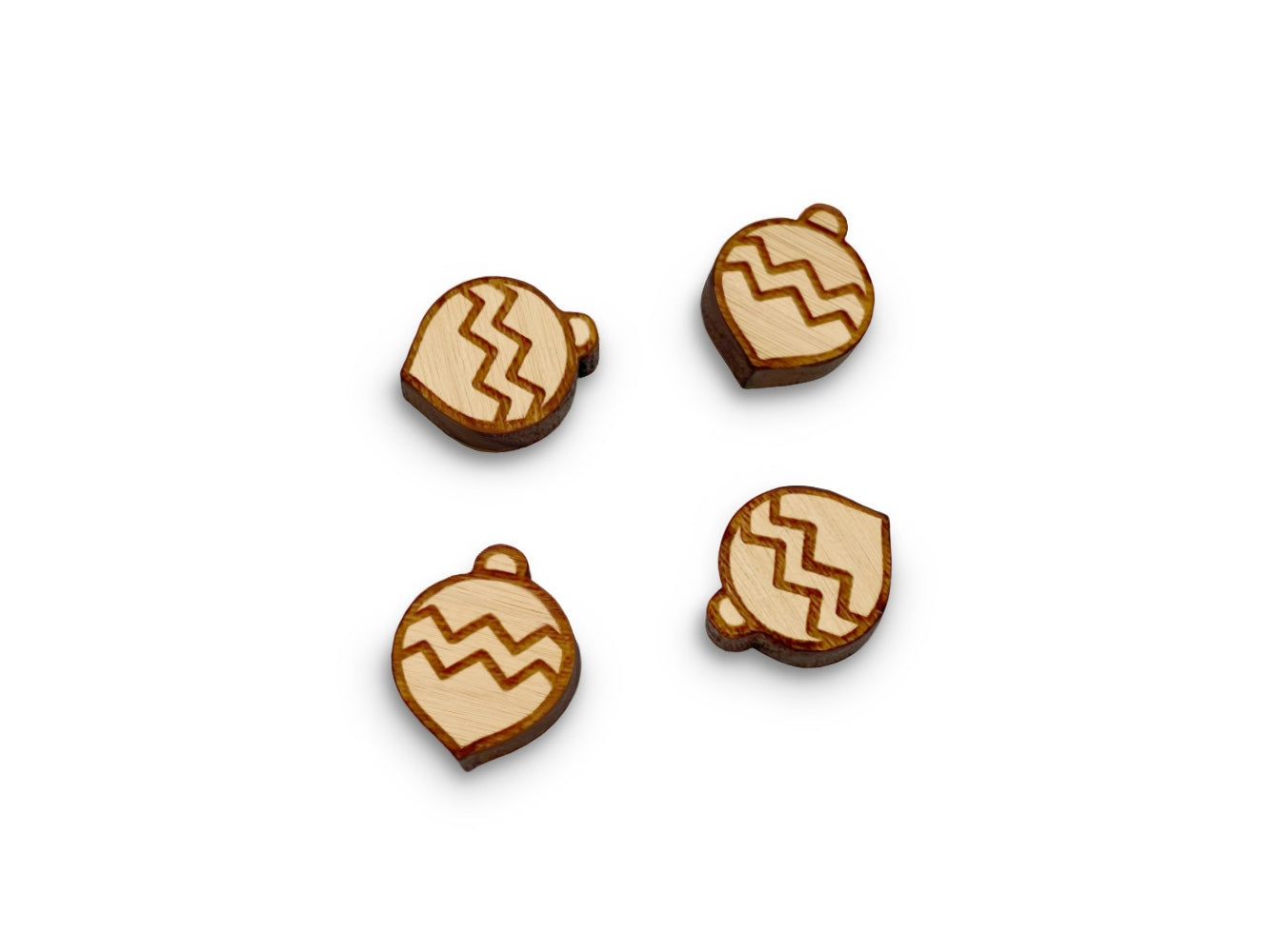 two pairs of wooden cabochon stud earring blanks cut and engraved to look like a Christmas ornament