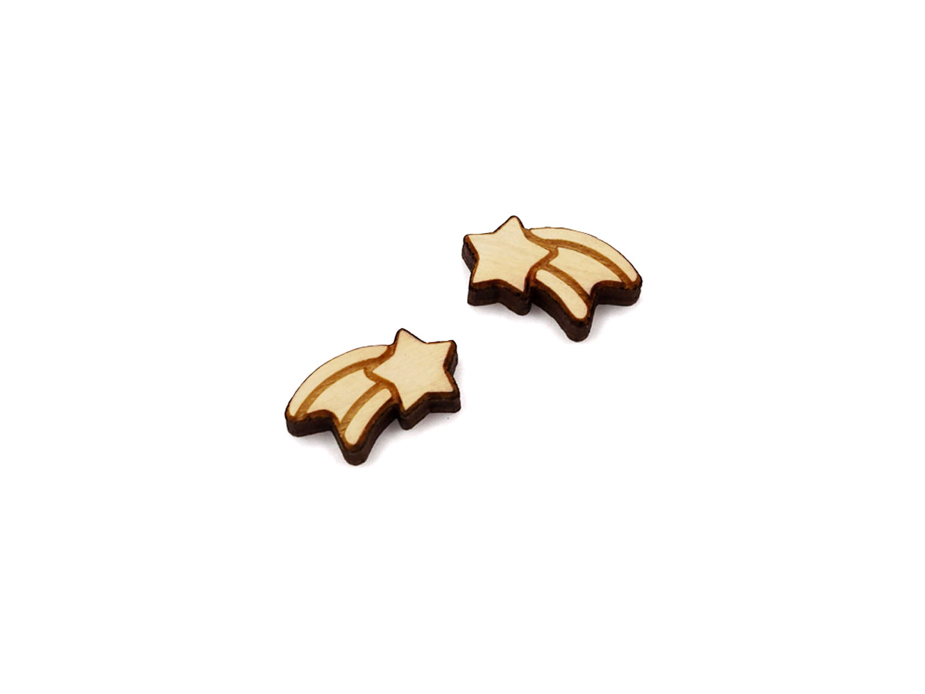 a pair of wooden cabochon stud earring blanks cut and engraved to look like a shooting star