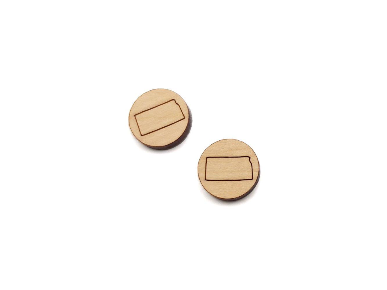 a pair of round wooden cabochon earring blanks engraved with the state of Kansas outline