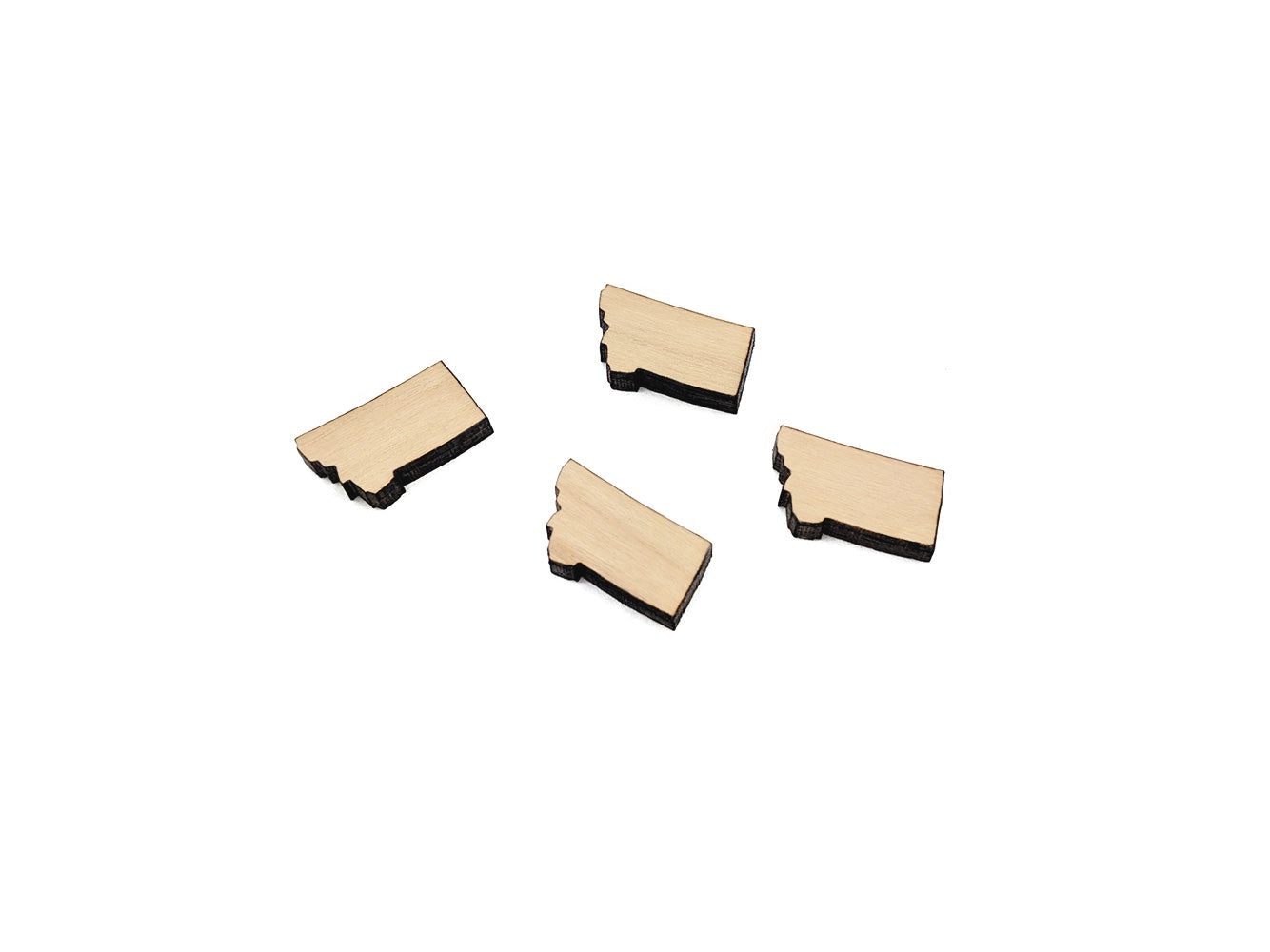 a group of wooden pieces sitting on top of a white surface