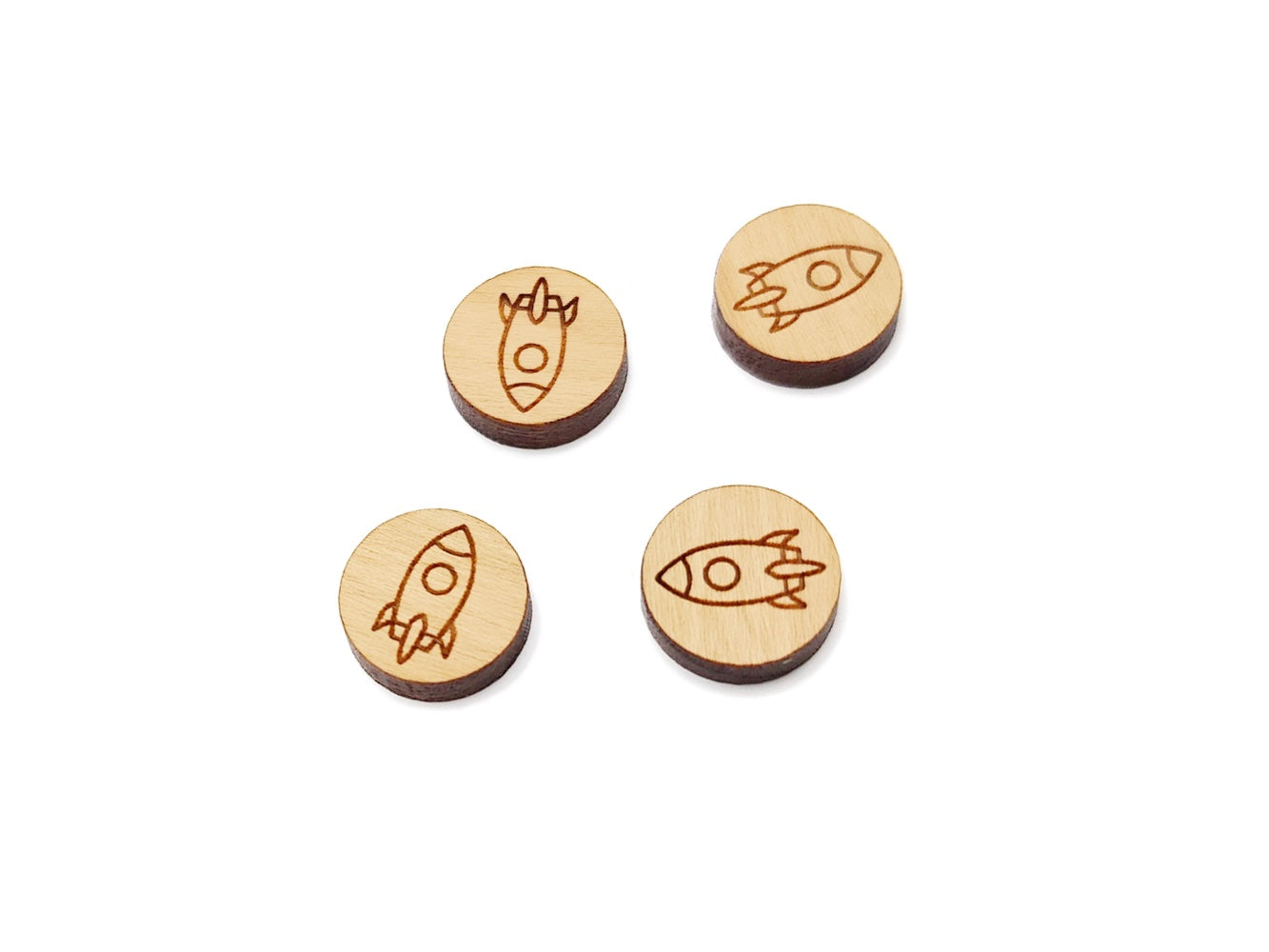 two pairs of round wooden cabochon earring blanks engraved with a rocket ship design
