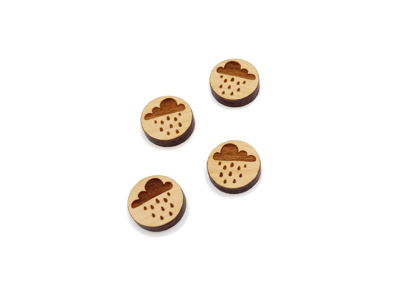two pairs of round wooden cabochon earring blanks engraved with a rain cloud design
