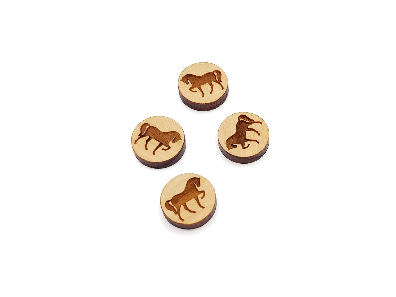 three wooden buttons with horses on them