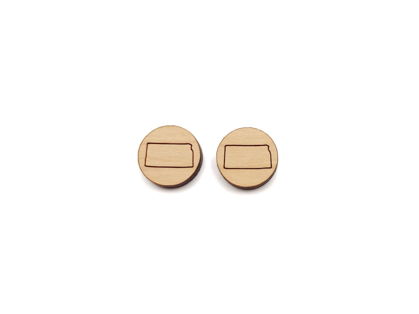a pair of round wooden cabochon earring blanks engraved with the state of Kansas outline