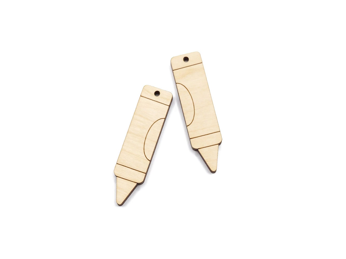 a pair of wooden earring blanks cut and engraved to look like a crayon