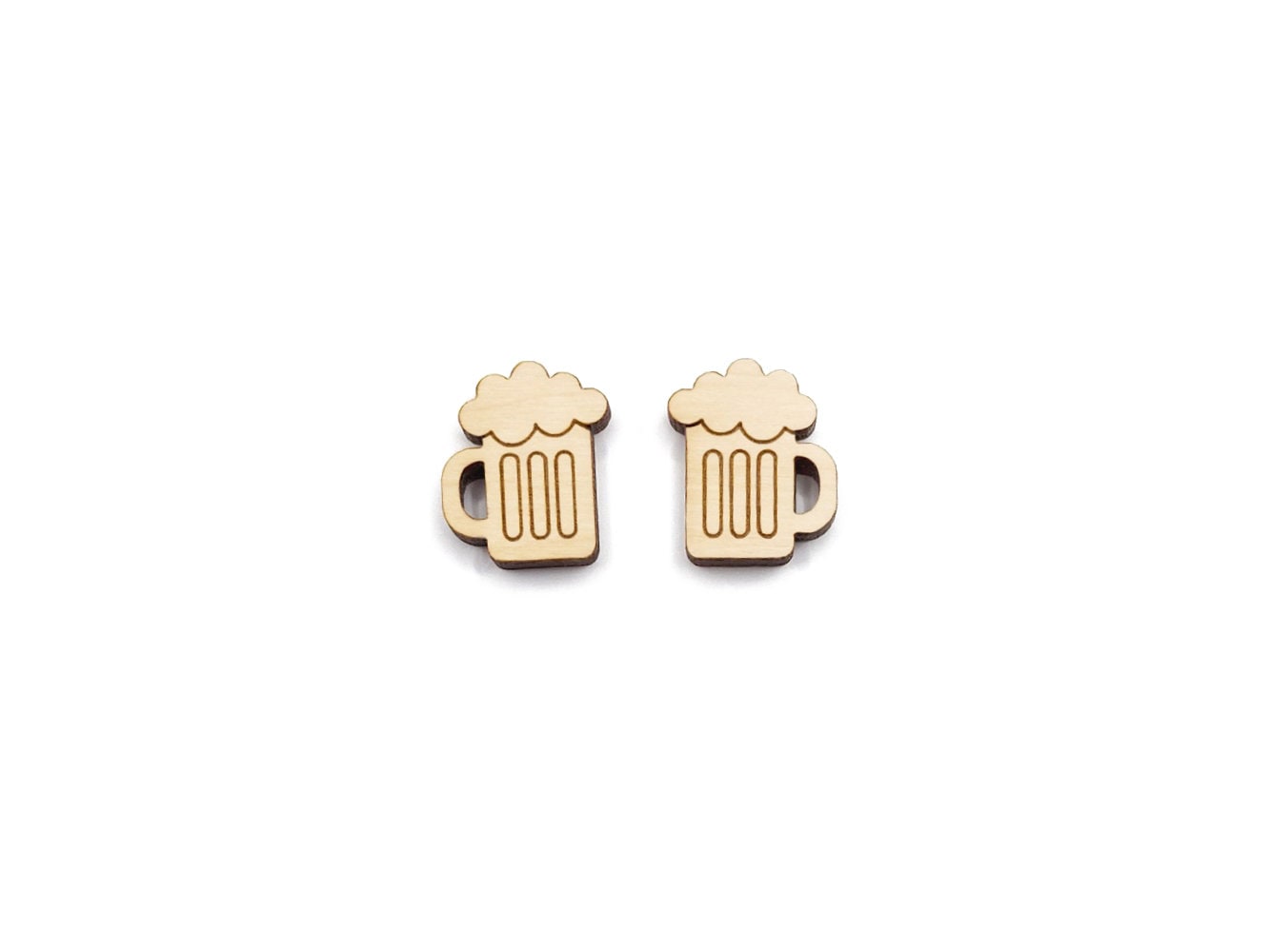 a pair of wooden cabochon stud earring blanks cut and engraved to look like mugs of beer