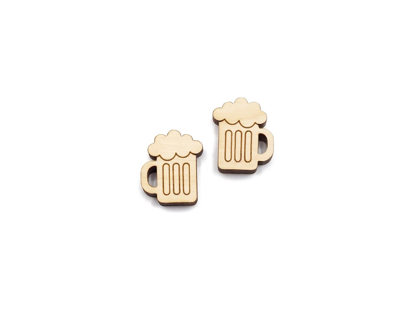 a pair of wooden cabochon stud earring blanks cut and engraved to look like mugs of beer