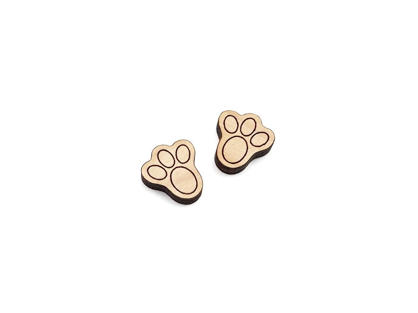 a pair of wooden cabochon stud earring blanks cut and engraved to look like bunny feet