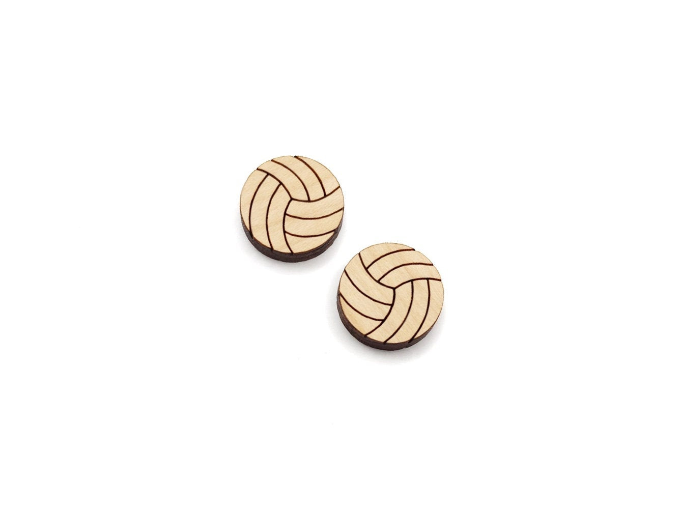 a pair of wooden cabochon stud earring blanks cut and engraved to look like volleyballs