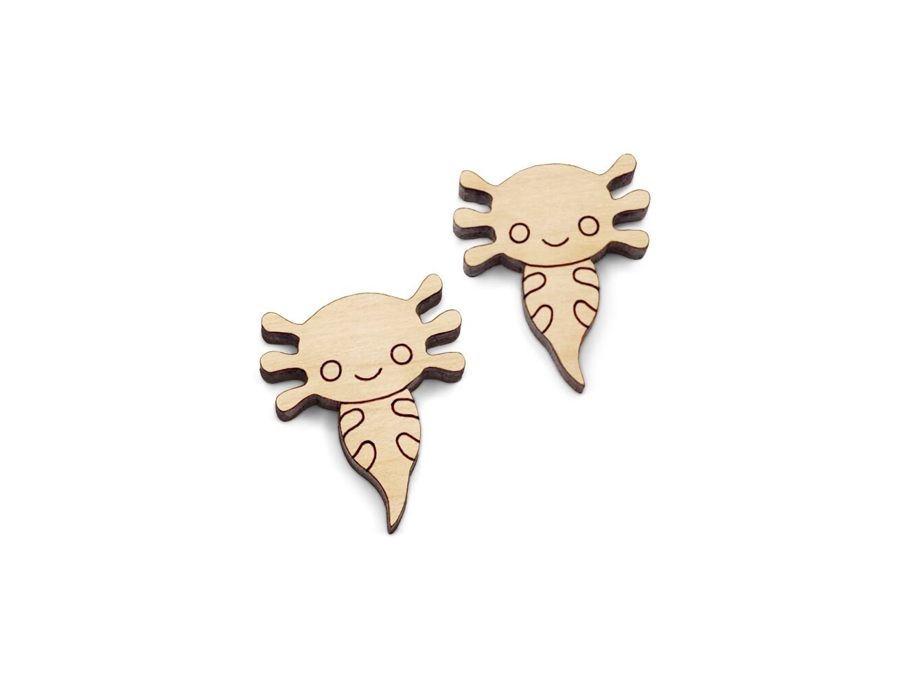 a pair of wooden cabochon stud earring blanks cut and engraved to look like axolotls