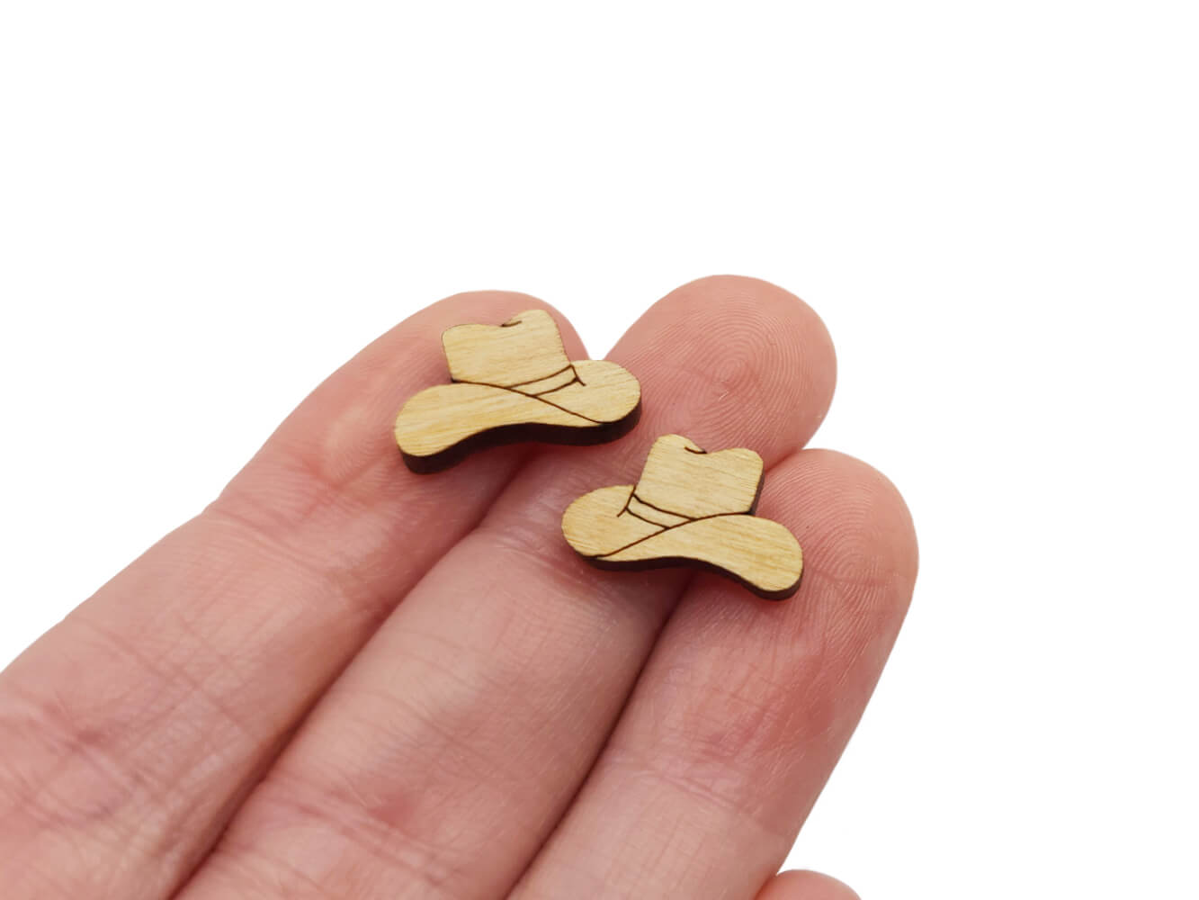 These cowboy hat laser-cut and engraved flat-back wood cabochon blanks are the perfect size to create stud earrings. You can paint them with creative color choices or keep the natural wood look with stains.