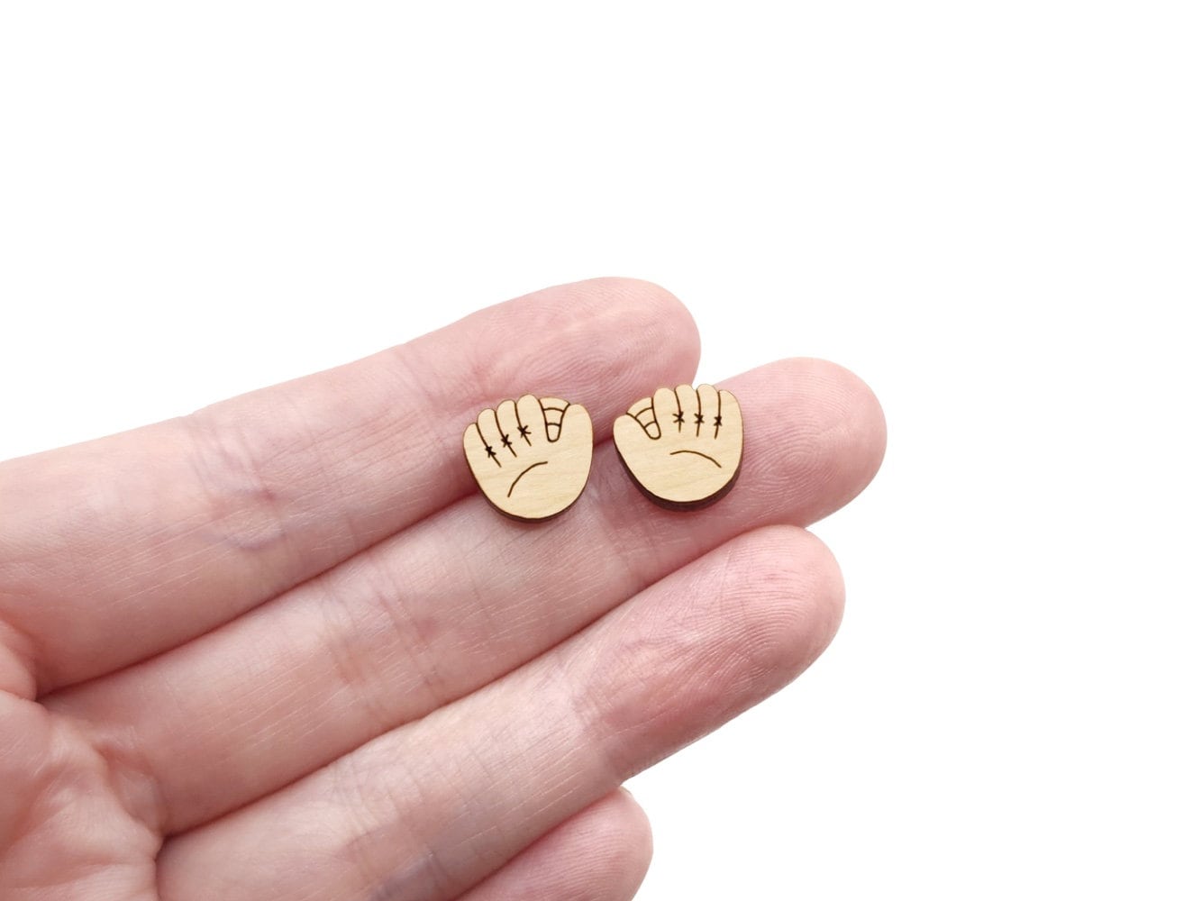 These baseball mitt engraved flat-back wood cabochon blanks are the perfect size to create stud earrings. You can paint them or keep the natural wood look with stains. They can also be used in other crafting projects.