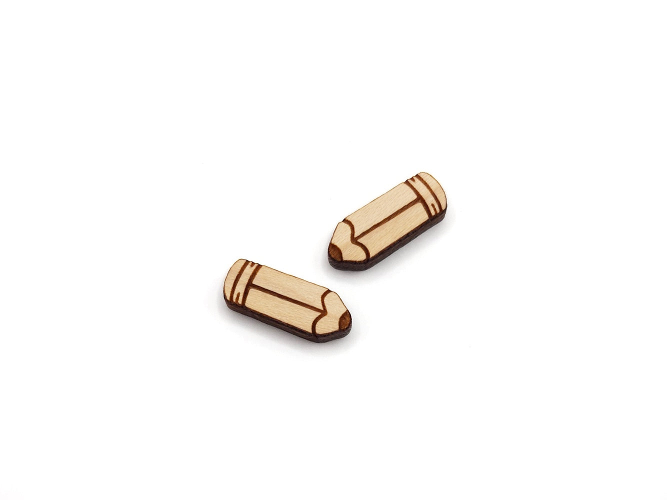 a pair of wooden cabochon earring blanks cut and engraved to look like a pencil