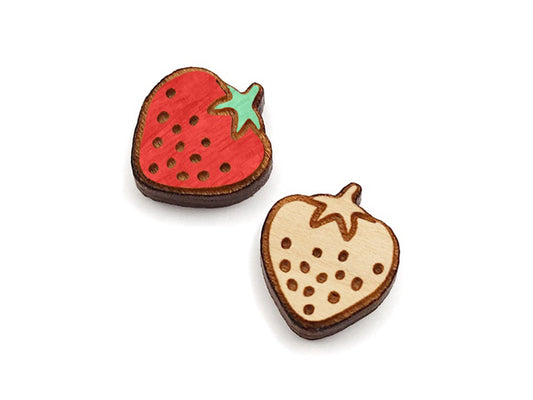 a pair of small wooden cabochon blanks for stud earrings, cut and engraved to look like strawberries