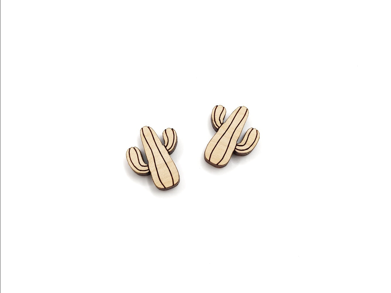 a pair of wooden cabochon stud earring blanks cut and engraved to look like a saguaro cactus