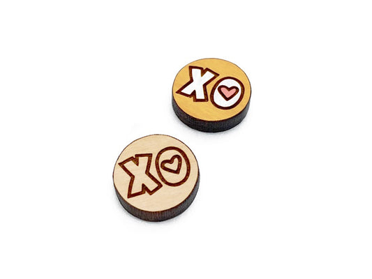 a pair of round wooden cabochon earring blanks engraved with an XO Heart design