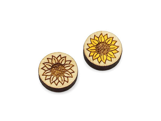 a pair of small round wooden cabochon blanks for stud earrings engraved with a sunflower