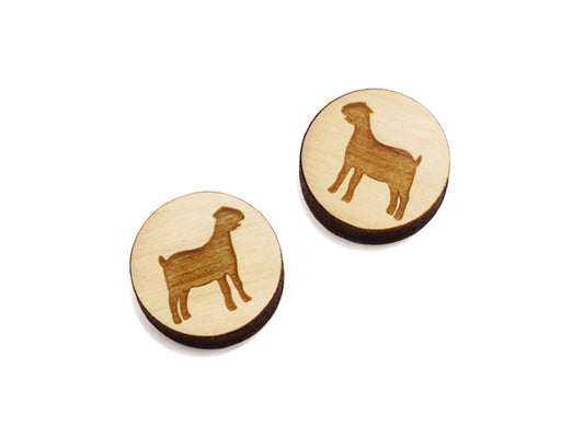a pair of round wooden cabochon earring blanks engraved with a nubian goat silhouette