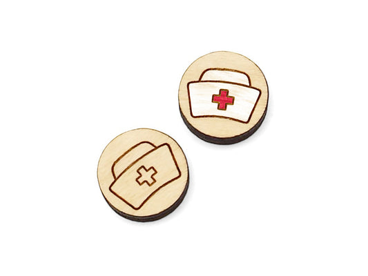 a pair of small round wooden cabochon blanks for stud earrings engraved with an old fashioned nurse hat