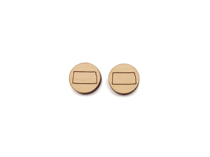 a pair of round wooden cabochon earring blanks engraved with the state of Kansas outline