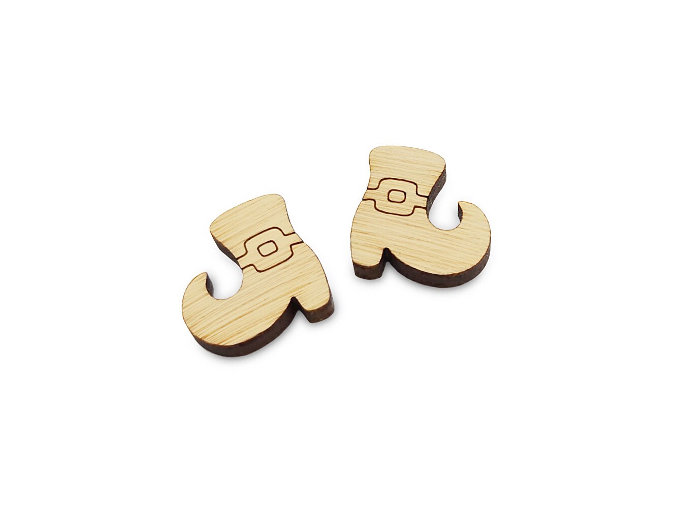 a pair of wooden cabochon earring blanks cut and engraved to look like Halloween witch shoes