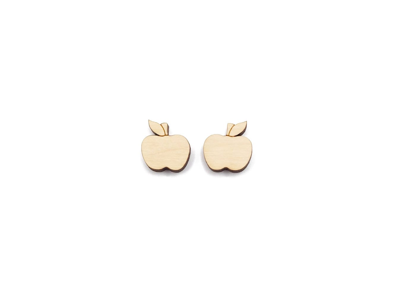 a pair of wooden cabochon stud earring blanks cut and engraved to look like an apple