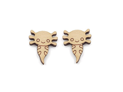 a pair of wooden cabochon stud earring blanks cut and engraved to look like axolotls