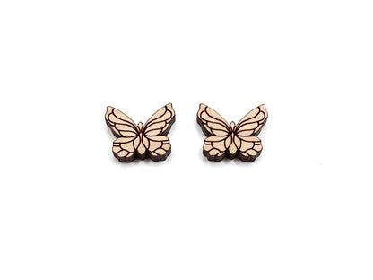 a pair of wooden cabochon stud earring blanks cut and engraved to look like butterflies
