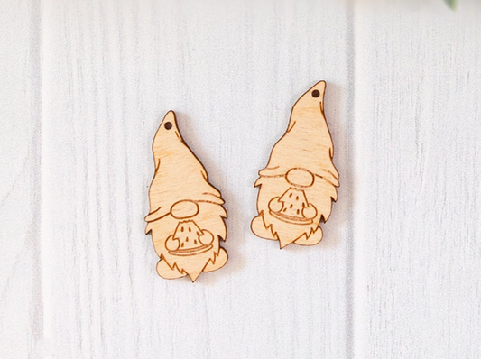 a pair of wooden earrings featuring a cartoon character